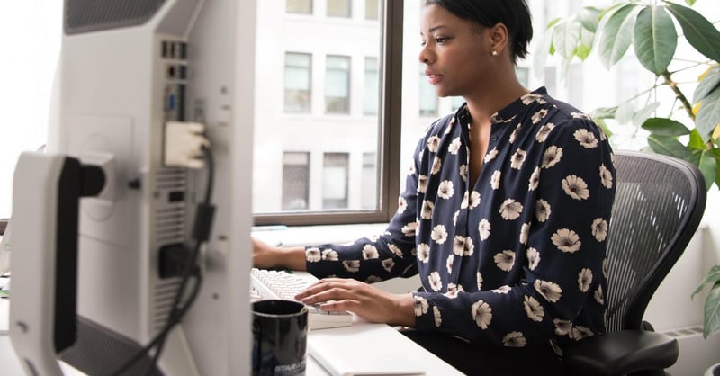 An employee sitting at a computer